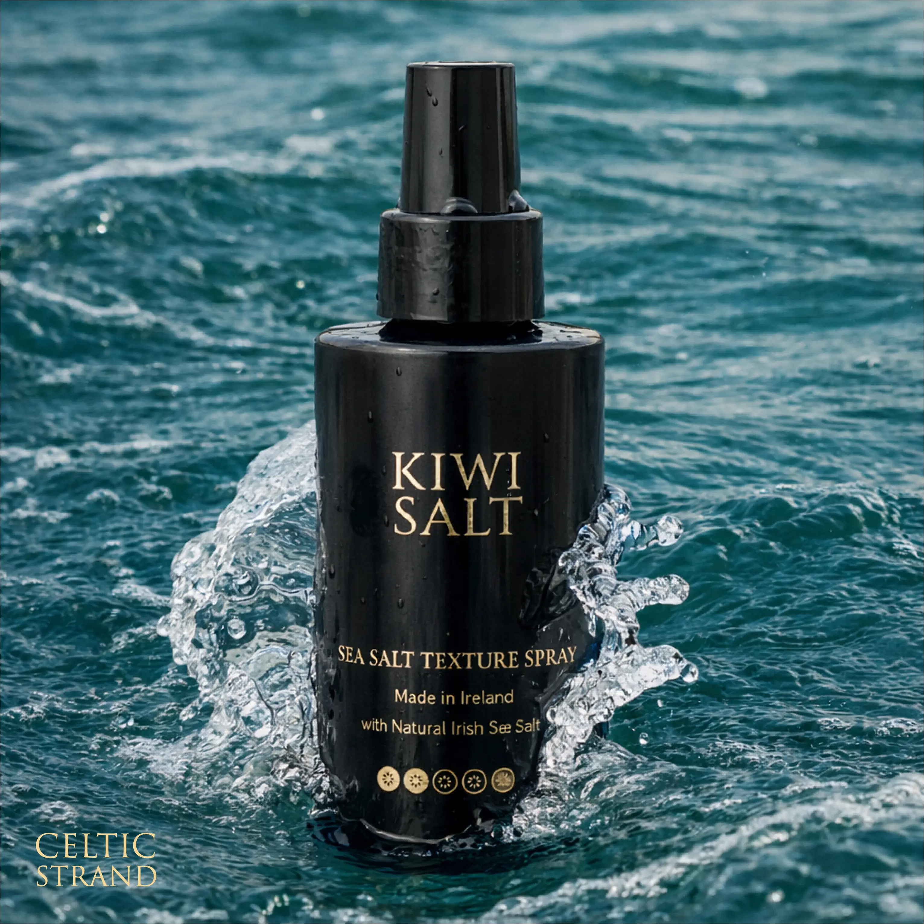 KiwiSalt Sea Salt Texture Spray bottle splashing in Atlantic ocean water, made with natural Irish sea salt.